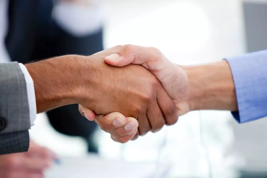 Close-up of business partners shaking hands